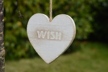 heart-shaped ornament with 'wish" printed on it