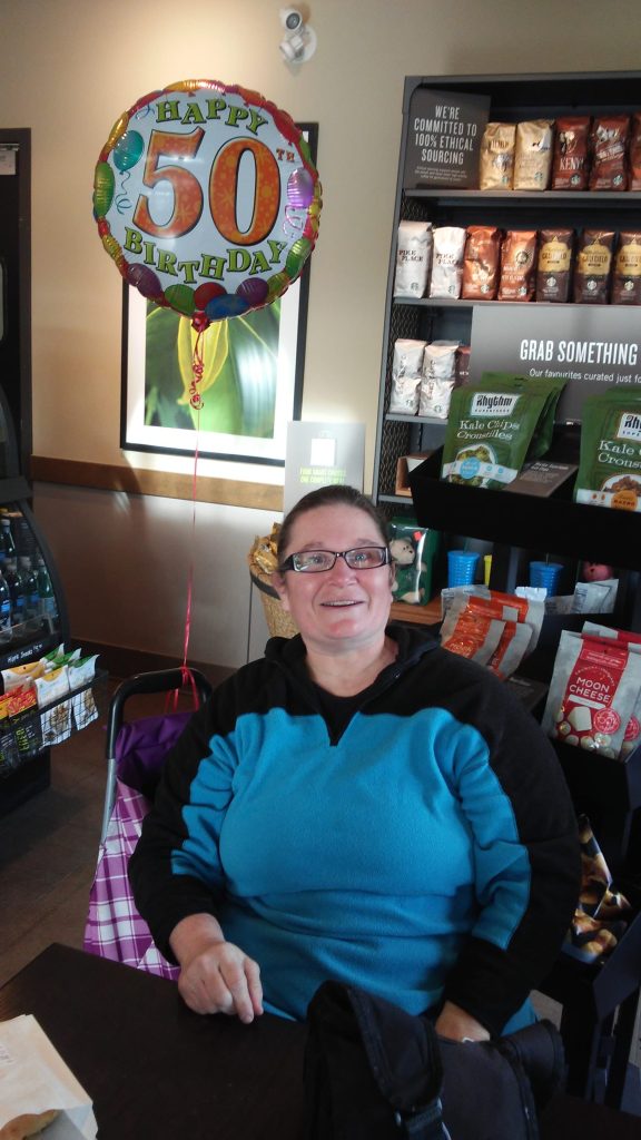 Lori with 50th birthday balloon